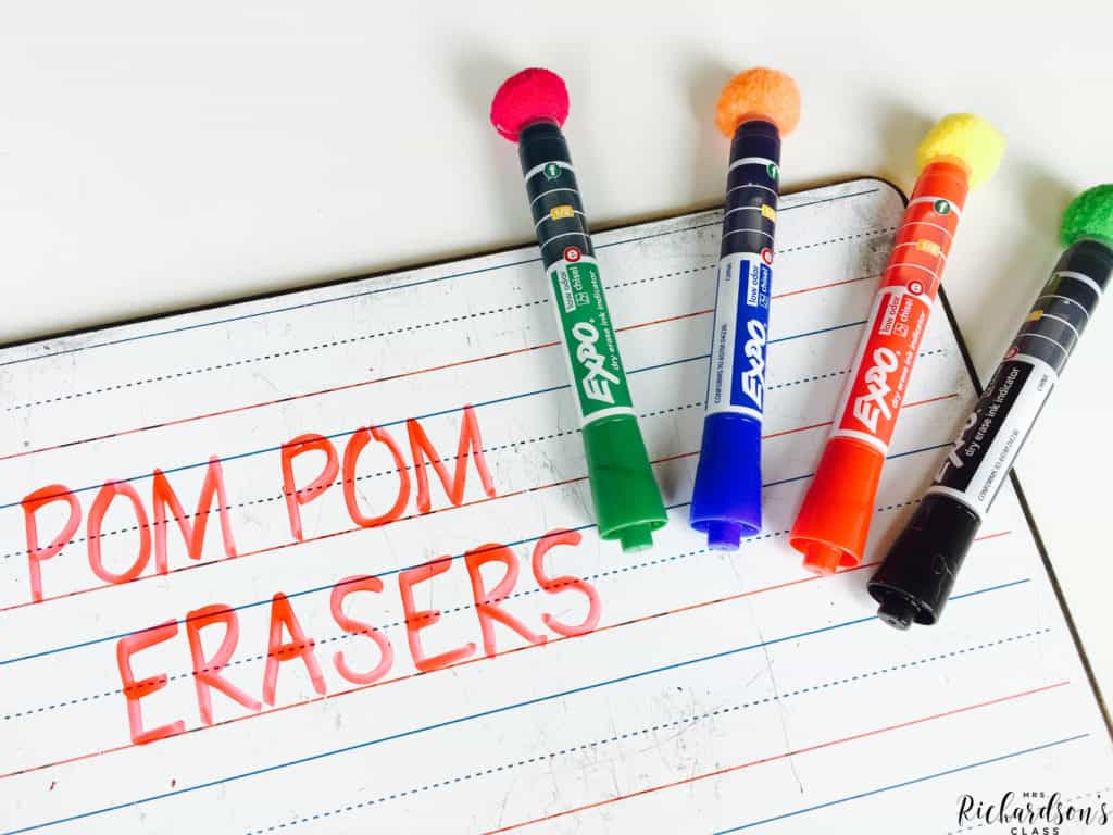 Hot glue pom poms to the end of EXPO markers to make erasers and markers two-in-one!
